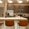 Kitchen with quartz countertops and stainless appliances