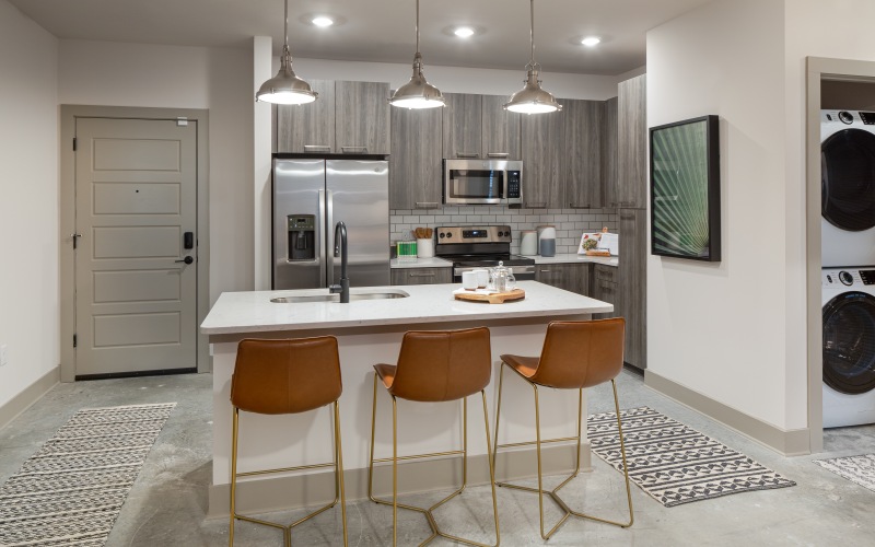 Photo of kitchen with island and stainless steel appliances